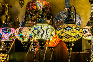 Wall Mural - Traditional bright decorative hanging Turkish lamps and colourful lights with vivid colours  in the Istanbul Bazaar, Turkey