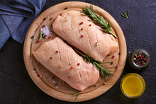 Raw Uncooked Poultry Meat Cut On Wooden Tray. Duck Breasts With Honey, Rosemary And Spices.
