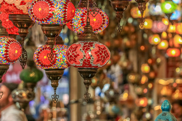 Wall Mural - Traditional bright decorative hanging Turkish lamps and colourful lights with vivid colours  in the Istanbul Bazaar, Turkey