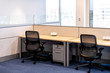 Empty office room with chairs wooden table and power outlet architecture and nobody by cubicle corporate desk