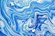 © Mirror Flow - Hand painted background with mixed liquid blue, white, yellow paints. Abstract fluid acrylic painting. Applicable for packaging, invitation, textile, wallpaper, design of different surfaces