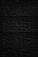 Abstract Black Brick Wall Texture Background. Vertical View Of Masonry Brick Wall.
