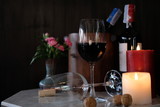Fototapeta Lawenda - glass of red wine and bottle of wine on wooden table