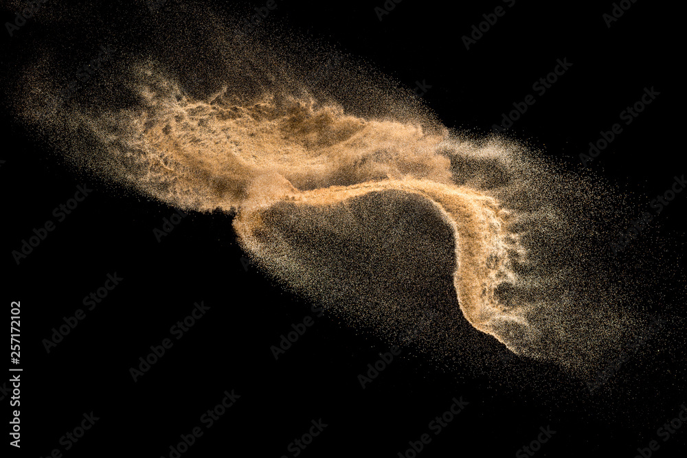 Golden dry river sand explosion isolated on white background. Abstract sand splashing.
