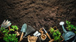 Gardening tools and seedlings on soil