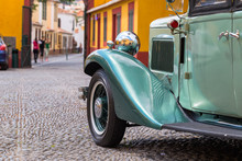 Wing, Wheel And Headlight Of A 1932 Vintage Car Parked In Fortaleza De Sao Tiago In Funchal.