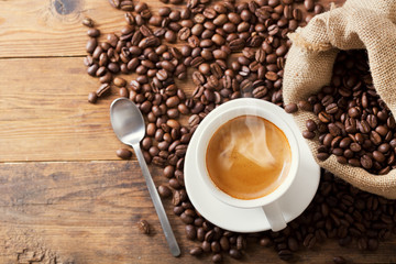 Wall Mural - cup of coffee and coffee beans, top view