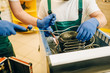 © Nomad_Soul - Workers with burner repairs refrigerator at home