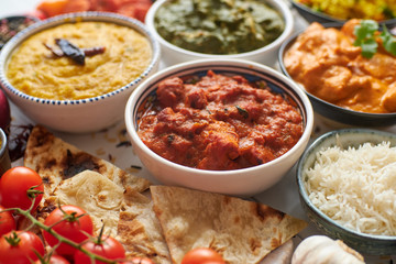 Assorted Indian various food with spices, rice and fresh vegetables