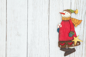 Wall Mural - A snowman on weathered whitewash textured wood background