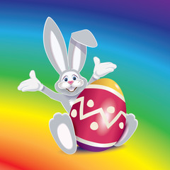 Wall Mural - Cute gray Easter Bunny with colored egg decorated with ornaments and rainbow on background