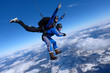 © Sky Antonio - Tandem skydiving. Two guys are having fun in the sky.