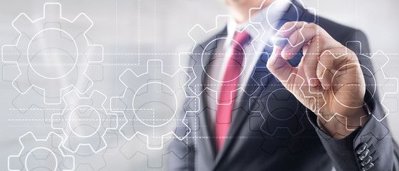 Wall Mural - double exposure gears mechanism on blurred background. business and industrial process automation co