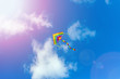 © Smole - Kite flying in the sky among the clouds