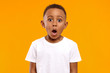 Leinwandbild Motiv Surprise, excitement and fascination concept. Funny bug eyed African little boy opening his mouth widely, shocked with astonishing unexpected news, having amazed look, showing full disbelief