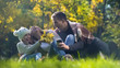 © motortion - Happy family spending time together in autumn park, picnic outdoors, having fun