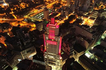 Aerial view of Santander's Lighthouse, a tourism point exactly in the center of Sao Paulo, Brazil. Great landscape. Flying during night. Sao Paulo's downtown.