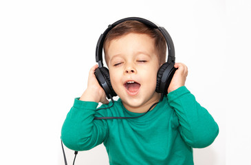 emotional boy in headphones on a light background