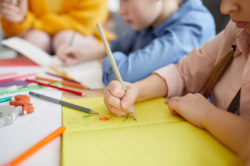 Wall Mural - Closeup of unrecognizable little girl making handmade greeting card for holiday, copy space