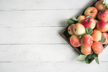 Red apples in wooden box