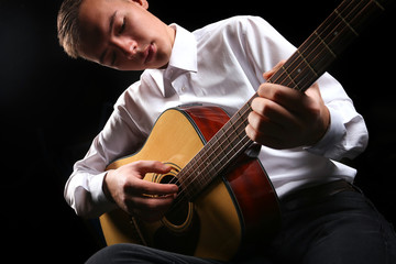 Wall Mural - Young men playing the guitar