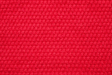 Wall Mural - Seamless red knitted fabric background. Close-up.