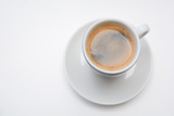 Fototapeta Mapy - Strong espresso served in white cup and saucer
