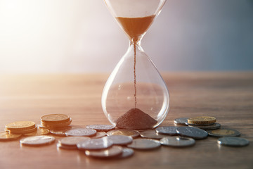 hourglass with coins