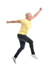 Poster - Mature woman jumping against white background