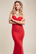 Gorgeous elegant blonde woman wearing fashion red dress