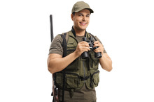 Young Hunter In A Uniform Holding Binoculars And Smiling At The Camera