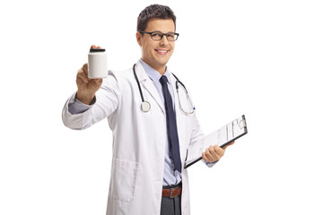 Poster - Young male doctor holding a bottle of pills and a clipboard