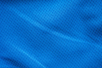 Blue fabric sport clothing football jersey with air mesh texture background