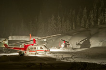 Bell 212 And 206 Helicopters Used For Heli-skiing Parked In Heavy Snowfall In Canada.