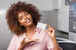 © Samuel B. - Young black African American woman holding a laundry subscription card