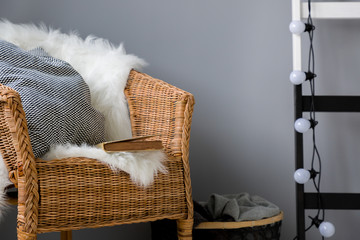 Canvas Print - Wicker chair and light chain