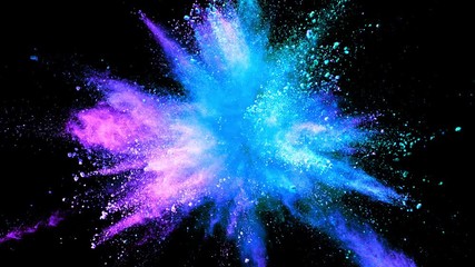 Super slowmotion shot of color powder explosion isolated on black background.