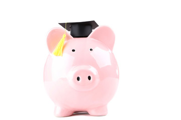 Wall Mural - Piggybank with graduation cap isolated on white background