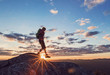 © Cavan Images - Silhouette of female hiker at summit of Borestone Mountain at sunset, Maine, USA