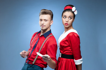 Wall Mural - Young couple wearing colorful old-fashion clothes