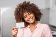 © Samuel B. - Young black African American woman holding a laundry subscription card