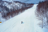 Fototapeta Nowy Jork - Winter holidays skiing at Sapporo Kokusai, Hokkaido, Japan.