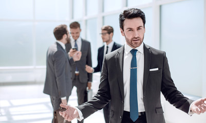 Wall Mural - friendly businessman standing in the office.