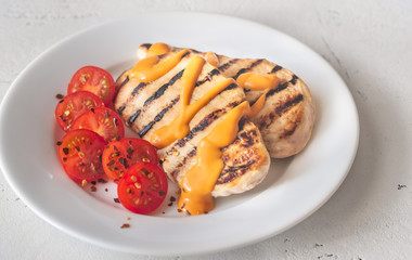 Wall Mural - Grilled chicken breast with sauce and cherry tomatoes