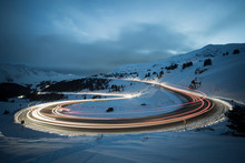 Long Exposure Of Winter Traffic On Colorado Highway 6 Traveling Over Loveland Pass At Night.