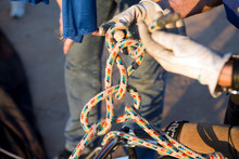 Hands Of Man Holding Ropes While Preparing For Hot Air Balloon Launch, Albuquerque, New Mexico, USA