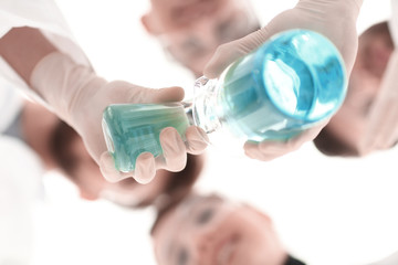 Wall Mural - image is blurred. beakers in hand, and scientists