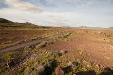 Dirt Road Through Volcanic Landscape