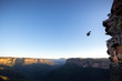 © Cavan Images - Silhouette of BASE jumper against clear sky, New South Wales, Australia
