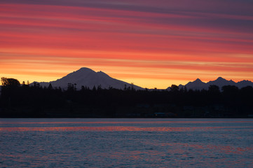 Wall Mural - Sunrise Over the Active Volcano, Mt. Baker, in the North Cascade Mountain Range. Mt. Baker is one of the snowiest places in the world and is located 31 miles east of Bellingham, Washington.